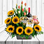 CANASTA ROMANCE DE GIRASOLES, TULIPANES, BOMBONES, VINO Y PELUCHE