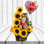 ARREGLO DE 7 GIRASOLES, BOMBONES, PELUCHE Y GLOBO