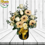 CAJA CILINDRICA DE 7 ROSAS, 5 GERBERAS, FOLLAJE Y LAZO