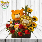 BASE DE MADERA CON 5 ROSAS, 4 GIRASOLES, FERREROS ROCHER 100GRS Y PELUCHE DE 20CM