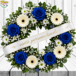 CORONA FUNEBRE CON 5 ROSAS AZULES, 4 GERBERAS, MARGARITAS, CINTA